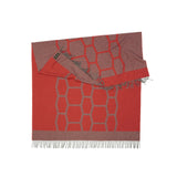 Travelblanket and scarf in a red gray pattern woven from Merino and Yak wool and ideal as a key piece for weekends on the beach with a classic car or in the mountains in a luxurious design with sustainability and the perfect gift and in a gas crisis to save energy and heat in the cold winter